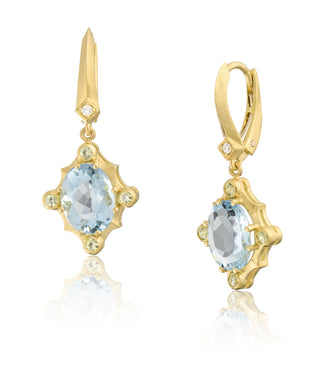 Side view of 18kt yellow gold Seaside earrings with aqua gemstones and diamond accents by John Apel.
