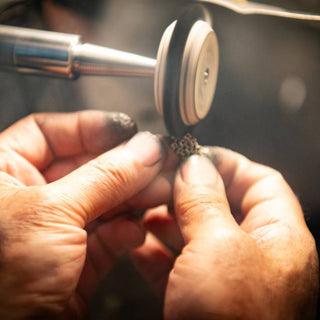 John Apel polishing fine jewelry – artisan hand-finishing of luxury gold and diamond pieces