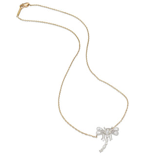 Gold chain with a delicate platinum dragonfly pendant on a white background.