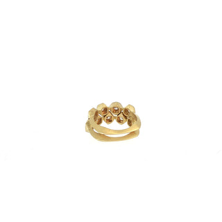 Profile detail of two paired John Apel Interstellar geometric diamond rings in yellow gold