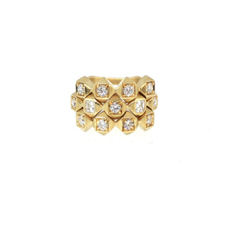 Three John Apel Interstellar diamond rings stacked in 18kt yellow gold, two stack rings with the five-stone ring, front view