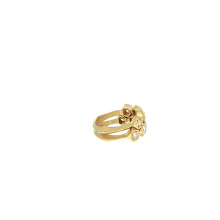 Interstellar stack ring paired with the five-stone diamond ring in 18kt yellow gold, side view