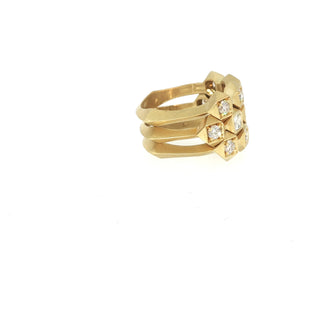 John Apel Interstellar three-ring geometric diamond stack in yellow gold, angled view