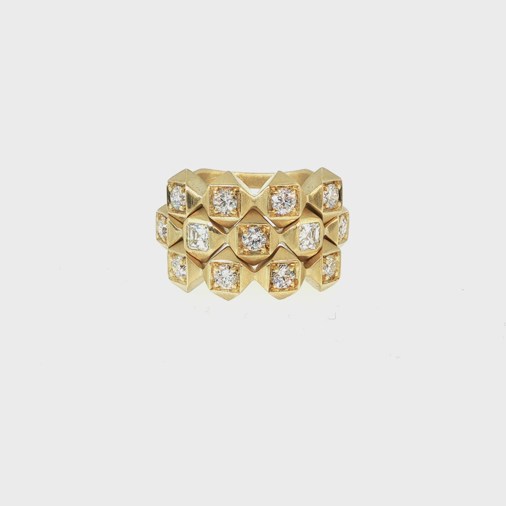 Video of three John Apel Interstellar geometric diamond rings worn as a full stack in 18kt yellow gold