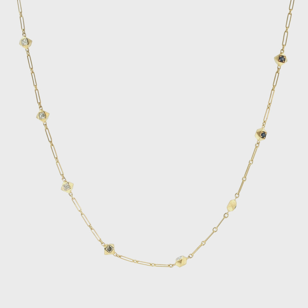 Video of the John Apel Interstellar chain necklace showing faceted Asscher-cut diamond and sapphire sections