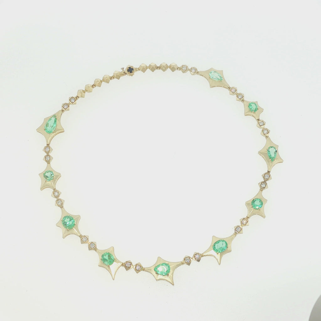 Video of the John Apel Interstellar Colombian emerald and diamond necklace in 18kt yellow gold
